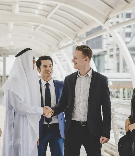 portrait-business-partners-greeting-one-another-by-handshaking-way-office (1)